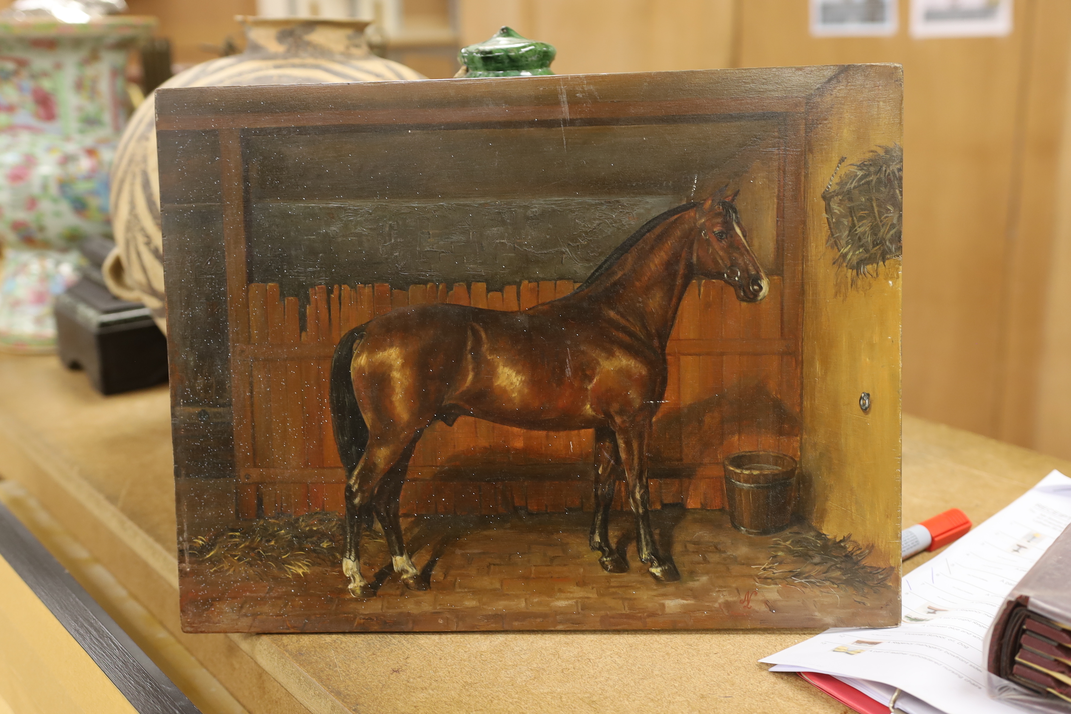 K. M. Nadler (20th. C), oil on board, Study of a bay horse in a stable, signed, 31 x 40cm, unframed